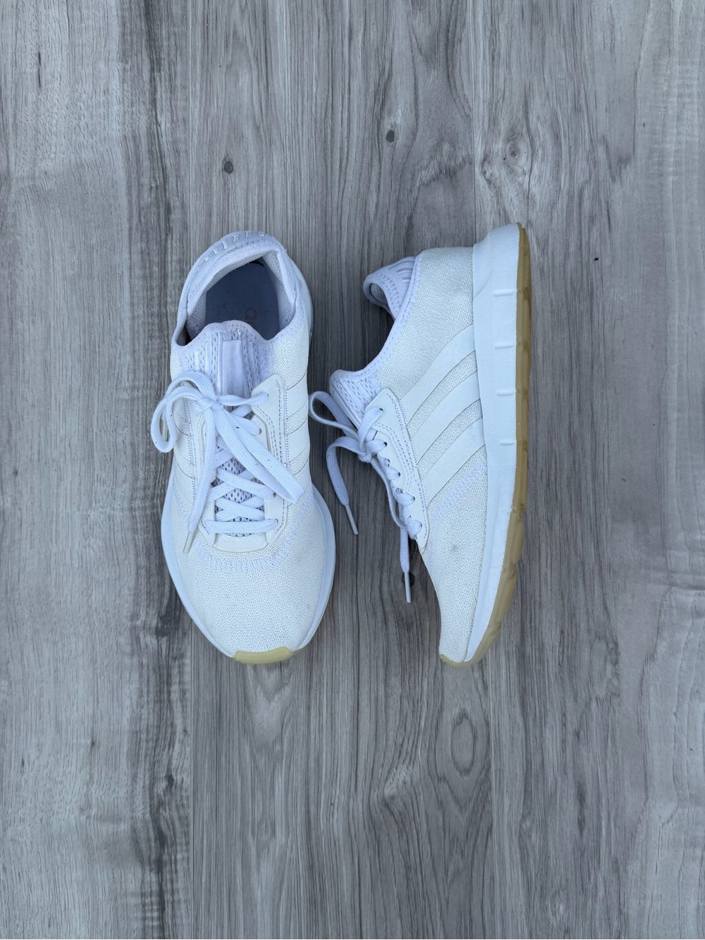 Adidas Swift Run sneakers in a clean white colorway - Women’s